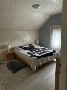 a bedroom with a large bed in a attic at Forest Escape House in Begovo Razdolje