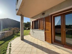 a porch of a house with a view of a mountain at Villa Olbia mare in Olbia