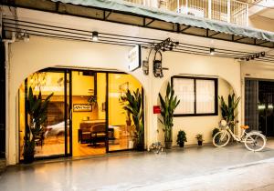 a bike is parked outside of a building at After Hours Guesthouse Self Check-in in Bangkok