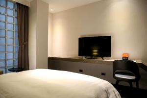 TV a/nebo společenská místnost v ubytování Wonstar Hotel