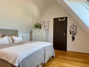 a bedroom with a bed and a black door at Wohnung Dorfblick in Hauenstein