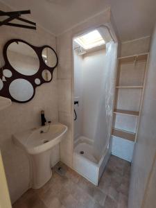a bathroom with a toilet and a sink and a shower at Sunny Quiet Nest in Jūrmala +20 photos