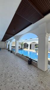 a view of a swimming pool in a building at Blessing Hotel Pandan in Halangan