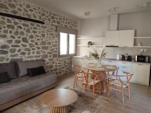 a living room with a couch and a table at Meteora Kalimera 1 in Kalabaka