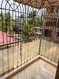 an empty room with a large window in a building at Sk Holiday Apartment in Alibaug