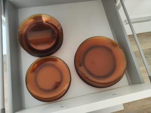 three brown plates in a white drawer at Gîte du Tilleul in Beire-le-Châtel +27 photos