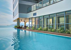 a rendering of a building with a swimming pool at Panorama Blue Beach Nha Trang in Nha Trang