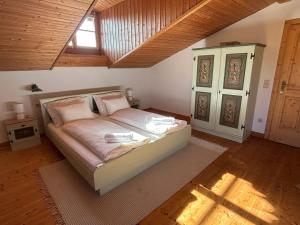 a bedroom with a bed in a room at Hörndlhof in Abtenau