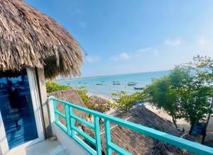 a view of the ocean from a balcony of a resort at Casa Violeta Beach House in Rincón