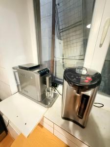 a coffee maker sitting on top of a counter at Одноместный номер на ключ в хостеле Single Hostel Room in Chişinău