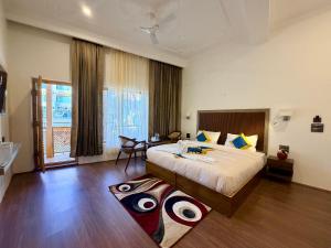 a bedroom with a large bed with eyes on it at Hotel shaynam in Leh
