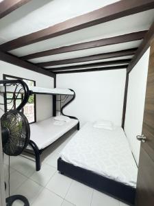 a room with a bunk bed and a fan at Casa con PISCINA PRIVADA Cielito in Flandes +29 photos
