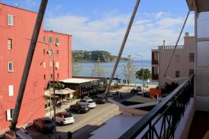 a view from a balcony of a street with cars parked at Casa Elefteria & Viron in Himare