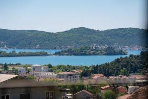 a view of a town with a lake in the background at Stars Apartments in Tivat