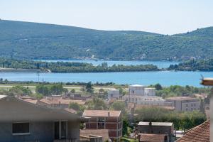 a view of a town with a large body of water at Stars Apartments in Tivat