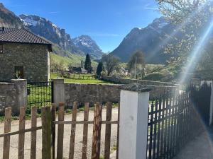 a fence with a view of a mountain at Guesthouse Idea in Vusanje