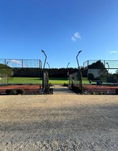 a park with a soccer field and street lights at The Bat Barn in Corsley +5 photos