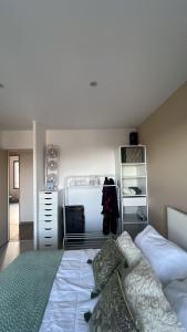 a bedroom with a bed and a closet at Chez TIKA in Saint-Lager +11 photos