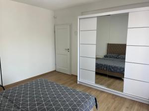 a bedroom with a bed and a large mirror at Al Noor Villa Ilidža in Ilidža +14 photos