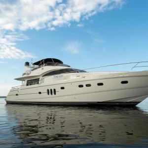 a white yacht sitting in the water on the water at The Lux Yachts - Luxury Private Yacht Experience in Helsinki