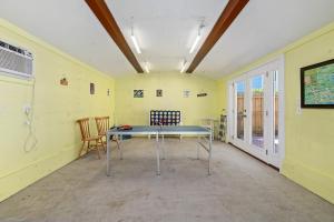 a room with a table and chairs in it at Downtown Gem- Dog Friendly Walk to Everything in St. Augustine