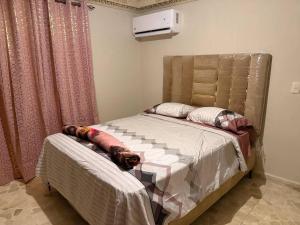 a bedroom with a bed with a dog laying on it at Segundo Piso complet in La Cuaba +37 photos