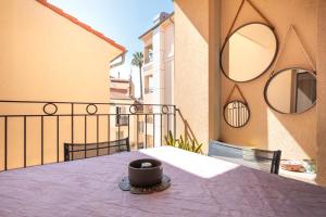 a cup sitting on top of a table on a balcony at 10 Rue de la Rampe in Cannes
