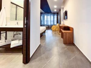 a room with a bed and a living room at Suiteincenter Rooms in Palermo +49 photos