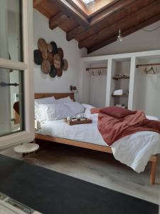 a bedroom with a bed with a tray on it at CamElia in Garlenda
