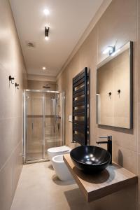 a bathroom with a sink and a toilet and a shower at Affittacamere Villa Soria in Pesaro