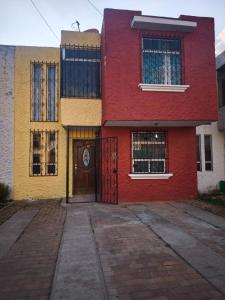 a colorful house with a door in front of it at Casa Mary's in Quetzaltenango