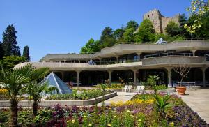 a large building with a garden in front of it at Bel Sole Badenweiler in Badenweiler