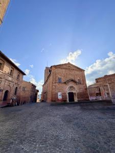 an old brick building on a cobblestone street at La Sibillina in Sarnano +18 photos