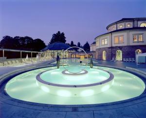 a water fountain in front of a building at Bel Sole Badenweiler in Badenweiler