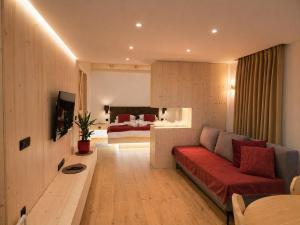 a living room with a couch and a bed at Bohinj Mountain Dreams in Bohinj