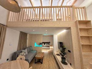a living room with a couch and a loft at Bohinj Mountain Dreams in Bohinj