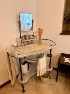 a glass table with a mirror on top of it at La Sibillina in Sarnano