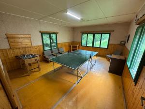 an empty room with a table and chairs in it at Chaty Kašperské Hory in Kašperské Hory