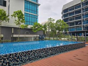 a large swimming pool in the middle of a building at PJ UM PacificStar Suite 2-3pax by DingDing in Petaling Jaya +6 photos