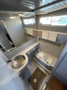 a small bathroom with a toilet and a sink at Confortable Yatch in Barcelona