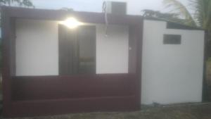 a house with a door and a light on it at Mandy's Villa in Bluefields