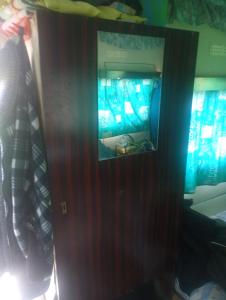 a reflection of a video game console in a room at Yupfssi camp in Riga