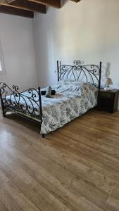 a bedroom with a bed with a teddy bear on it at La bâtisse a deux tours in Lalbenque +38 photos