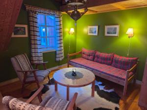 a living room with a couch and a table at Rorbu in Nusfjord, Lofoten in Nussfjord