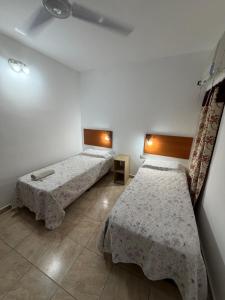 a room with two beds in a room at HOTEL REGINA Formosa in Formosa