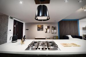 a kitchen counter with a stove top in a kitchen at Hal Saghtrija - Gozo Hideaways in Żebbuġ