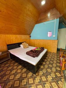 a large bed in a room with a basketball hoop at Golays homestay in Kalimpong