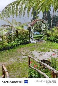 a picture of a garden with a garden with flowers at Golays homestay in Kalimpong +5 photos