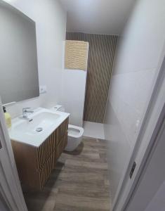 a bathroom with a sink and a toilet at Casa Alba del Cabo in Los Albaricoques +4 photos