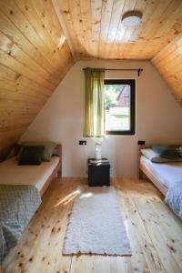 a room with two beds and a window at Josahouse in Bjeluša